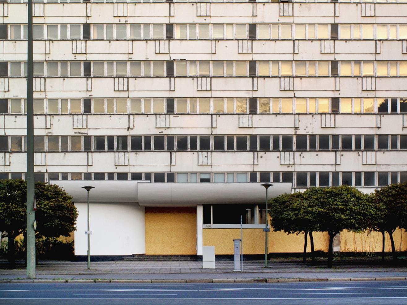 Yellow-gray facade of the abendoned Haus der Statistik, Berlin-Mitte