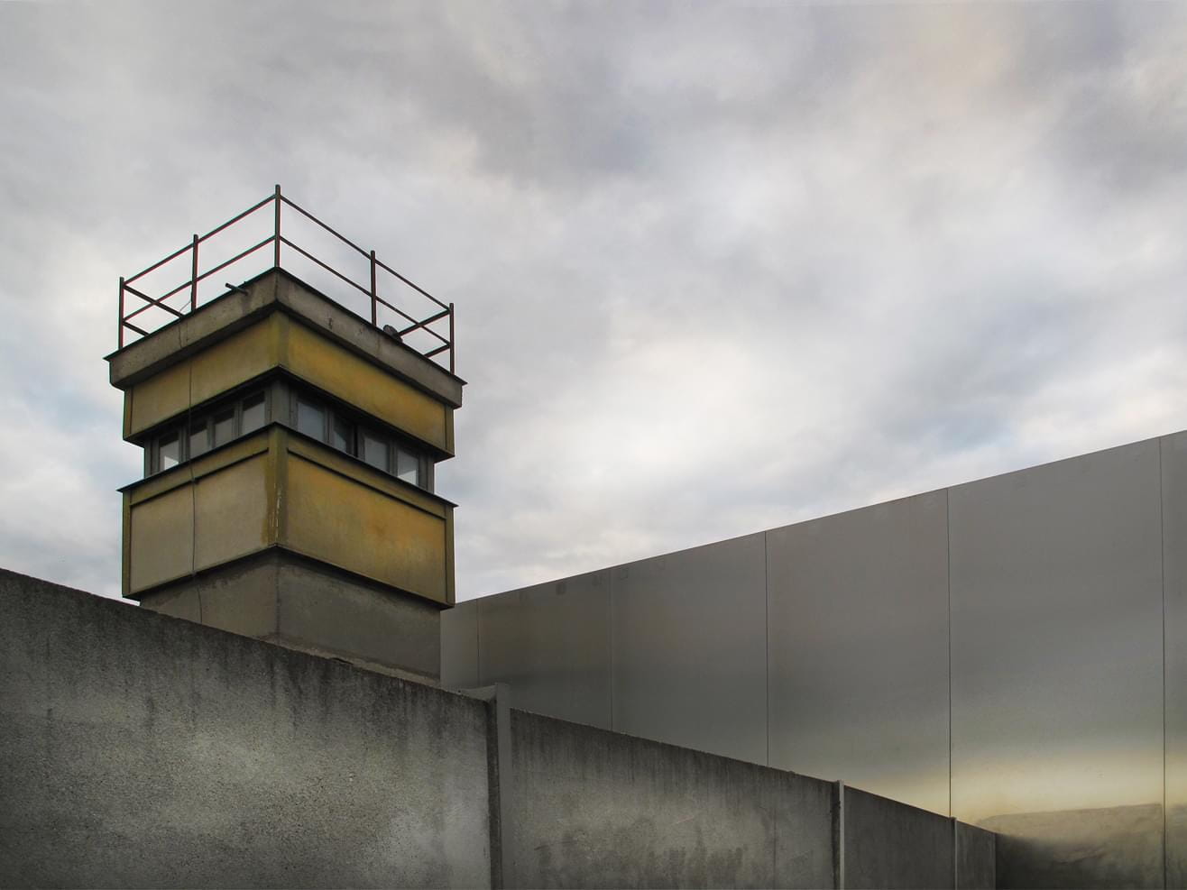 Reflection on the Wall Memorial in Berlin-Mitte with a watchtower, Bernauer Straße