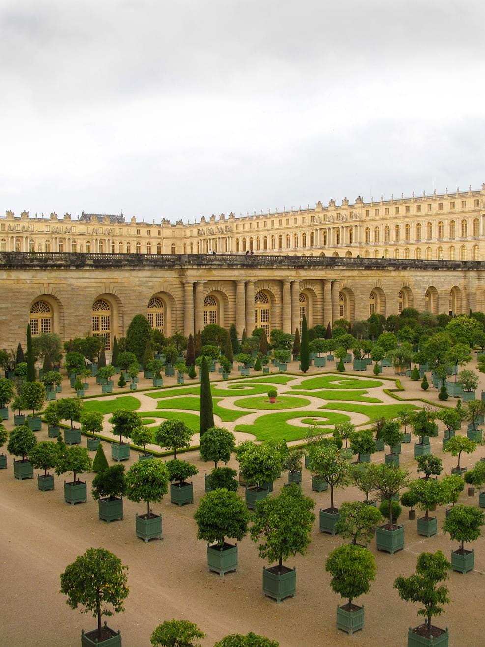 A view into the yard from Versailles Palace in France on a cloudy summers day